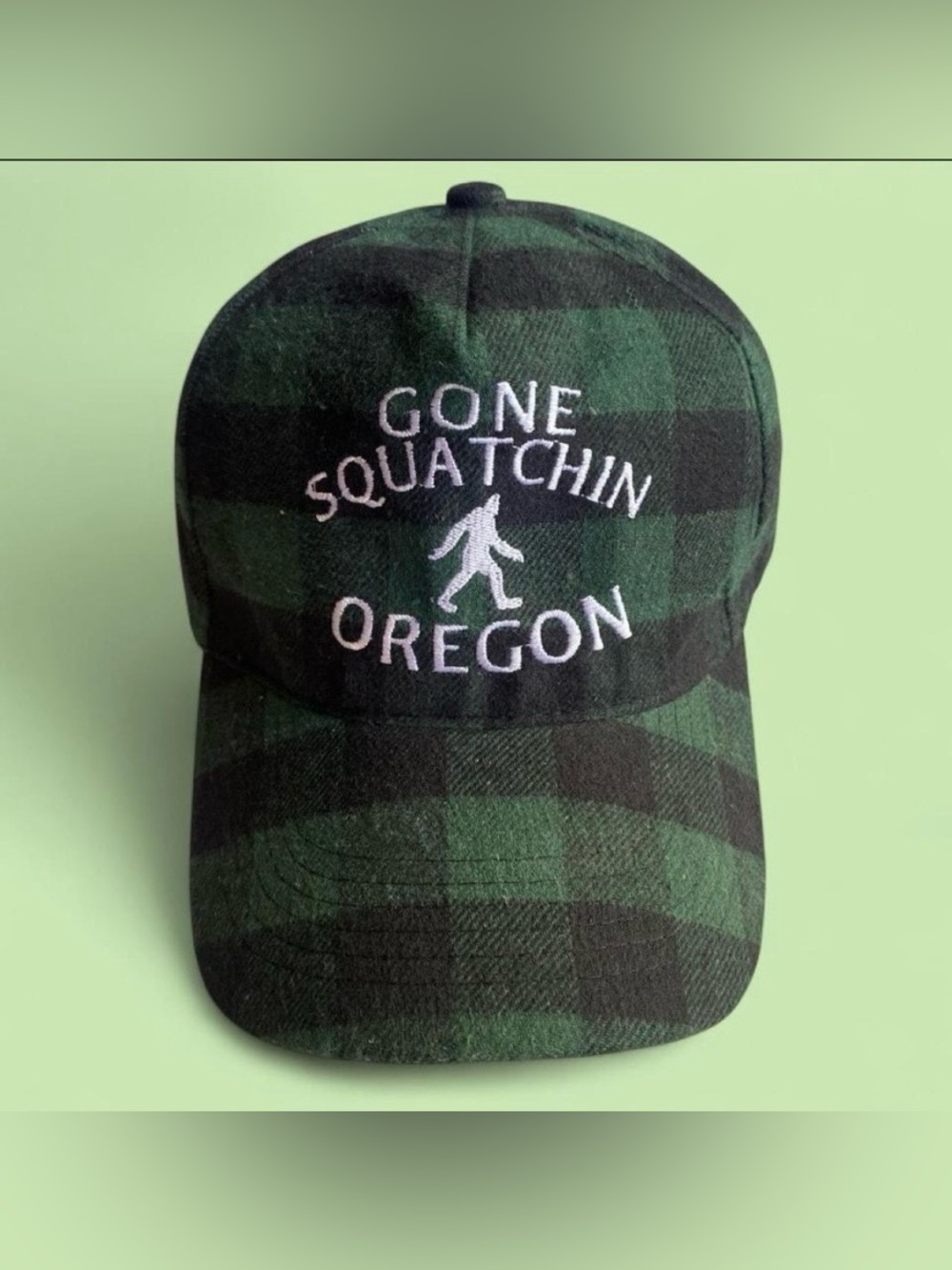 “GONE SQUATCHIN OREGON” Strap-back Cap Green and Black Buffalo Plaid